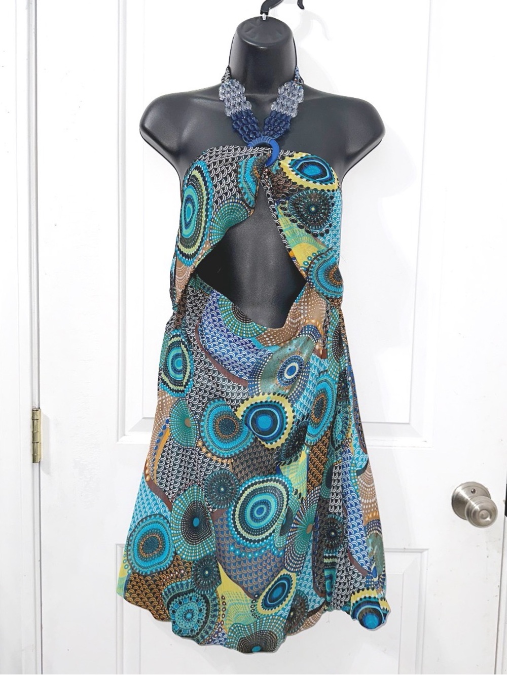 Y2K Liuce’s vibrant halter dress with a front cutout and beaded neck ring